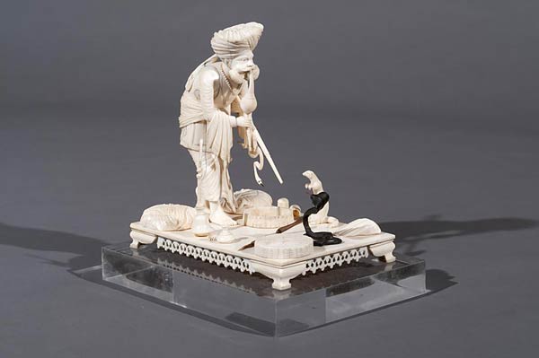 A Northern Indian Ivory Group depicting a Snake Charmer, 2nd half 19th century, Ivory & Ebony, 15.5 x 10.5 x 13.6 cms
